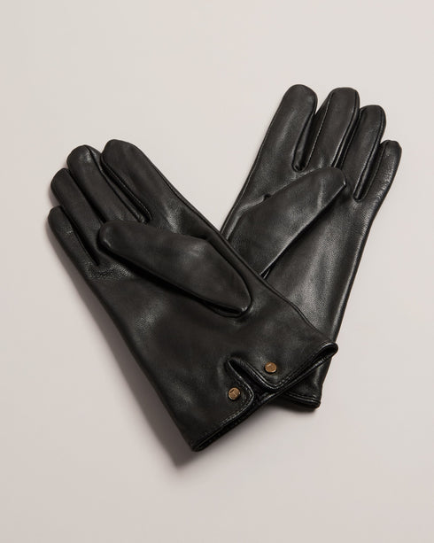 SOPHIIS-Gloves-Embrace the finer things in life with our beautifully crafted SOPHIIS gloves. Adorned with a charming knotted bow, they're a simple yet elegant way to warm up your look. Gloves Top grain leather Knotted bow embellishment Notched edge with magnolia studs- Ted Baker Romania